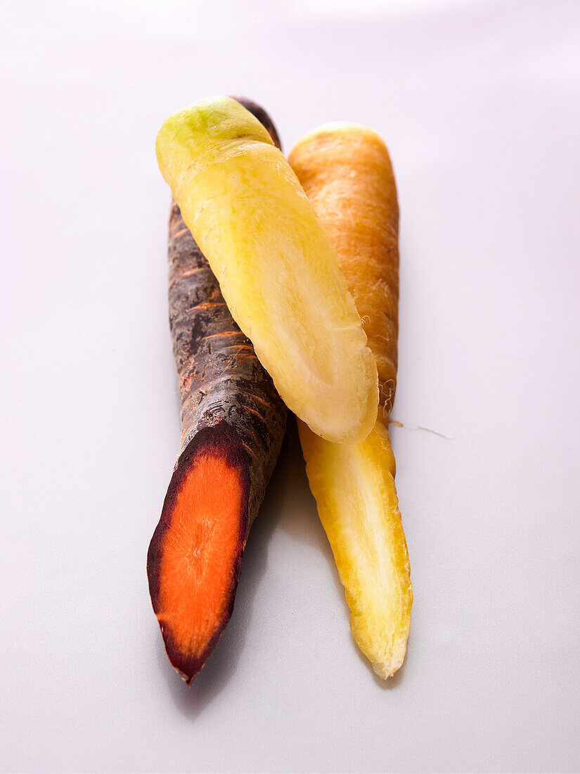 Colourful carrots on a light background