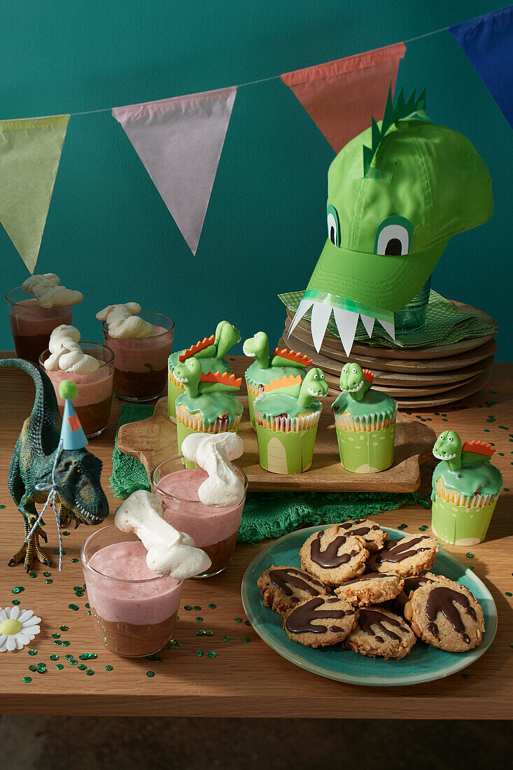 Dinosaur muffins, Stone Age cream and explorer cookies for a dinosaur party