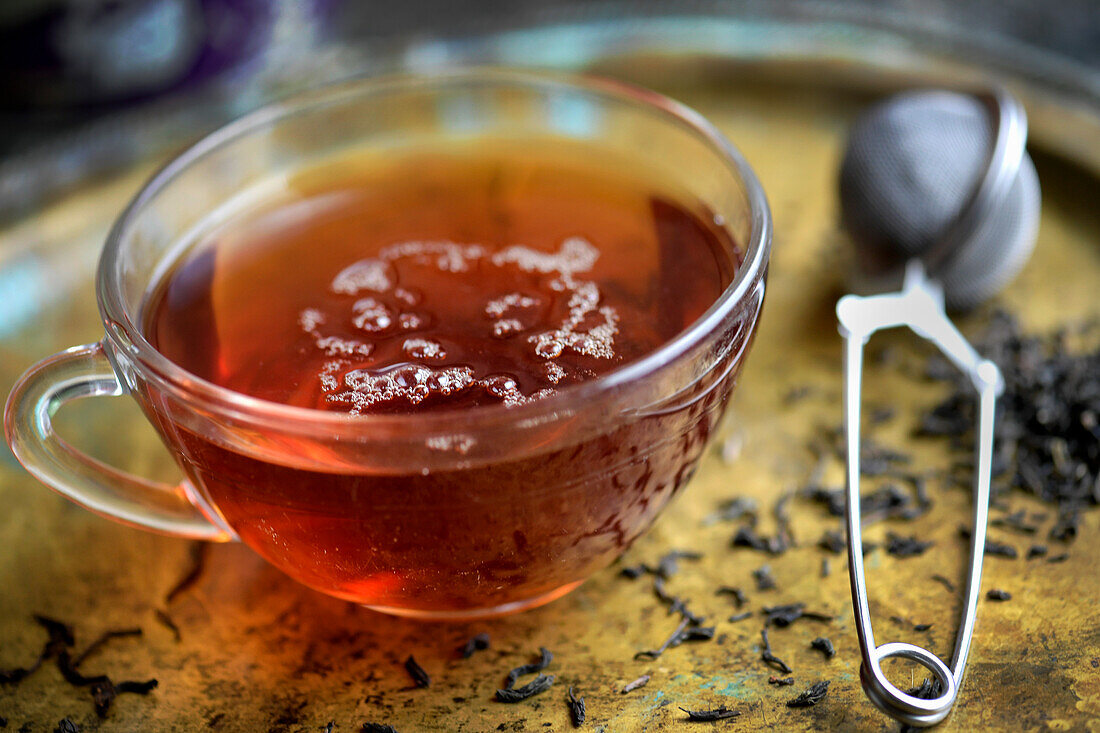 Cup of tea, a teaspoon and dissolved