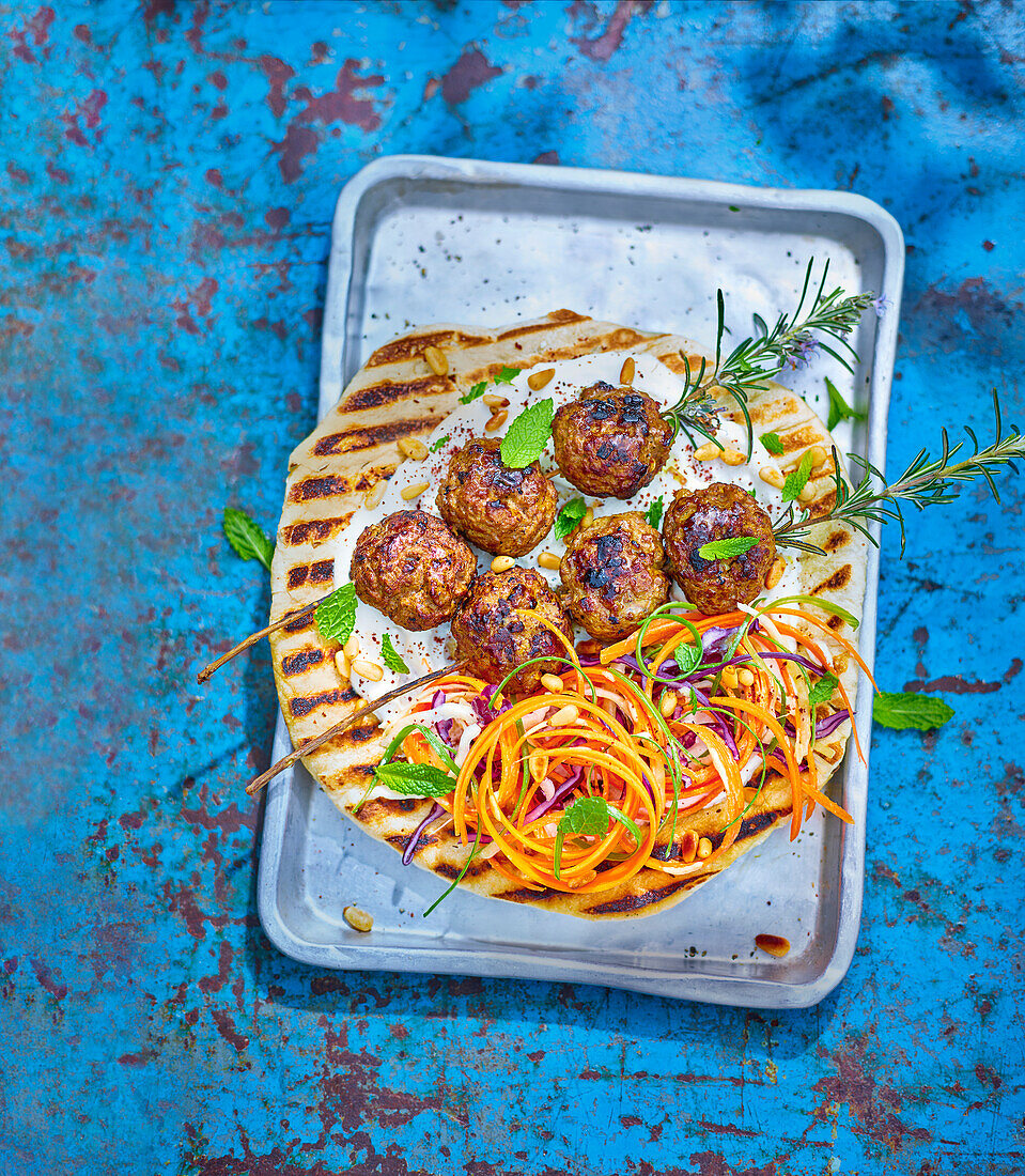 BBQ kofta with whipped feta and tahini slaw