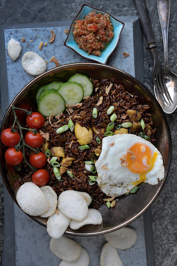 Indonesian nasi goreng with homemade sambal and fried egg