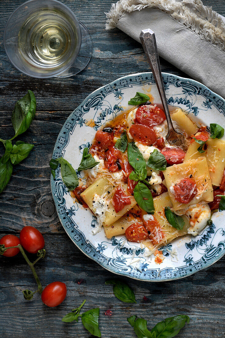 Pasta with tomatoes, burrata, and basil