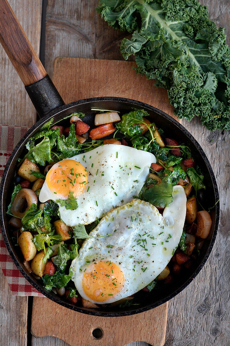 Kale and potato pan with chorizo and fried eggs