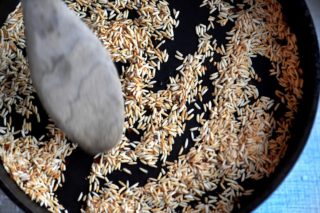 Toasting jasmine rice in a pan