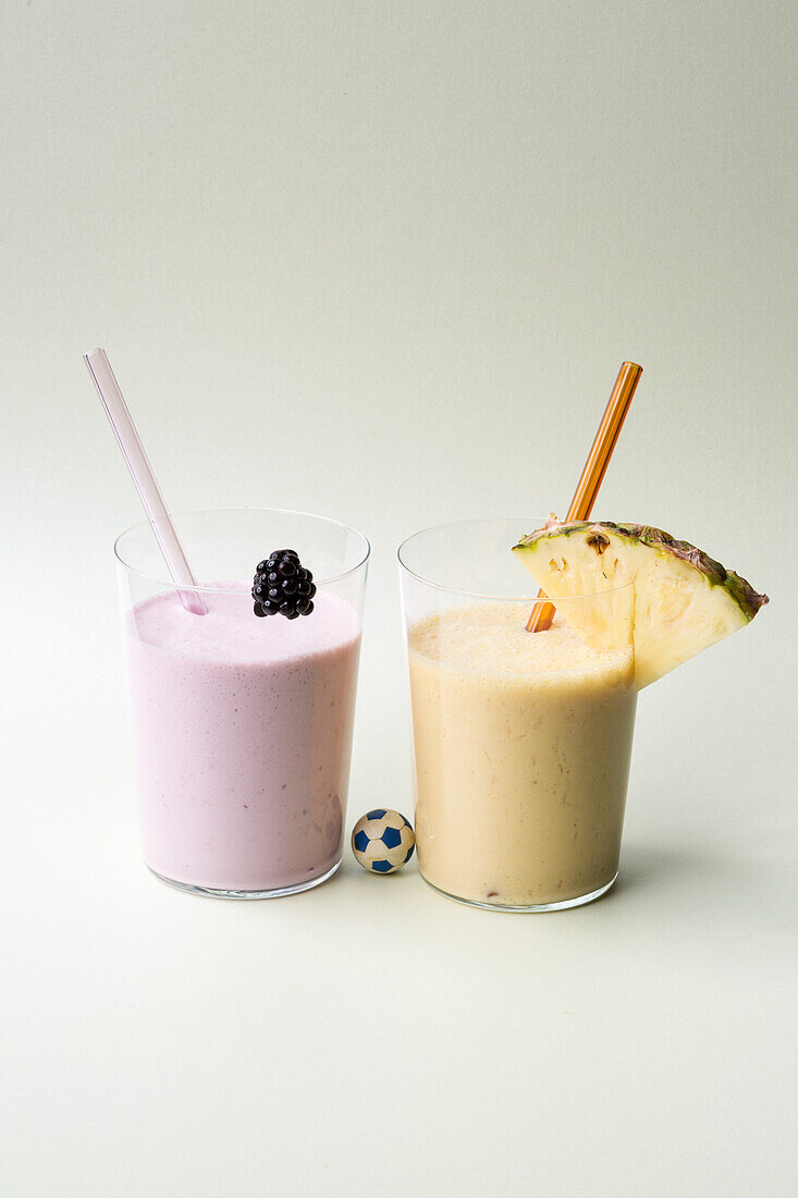 Protein shake with blackberries and pineapple-mango shake
