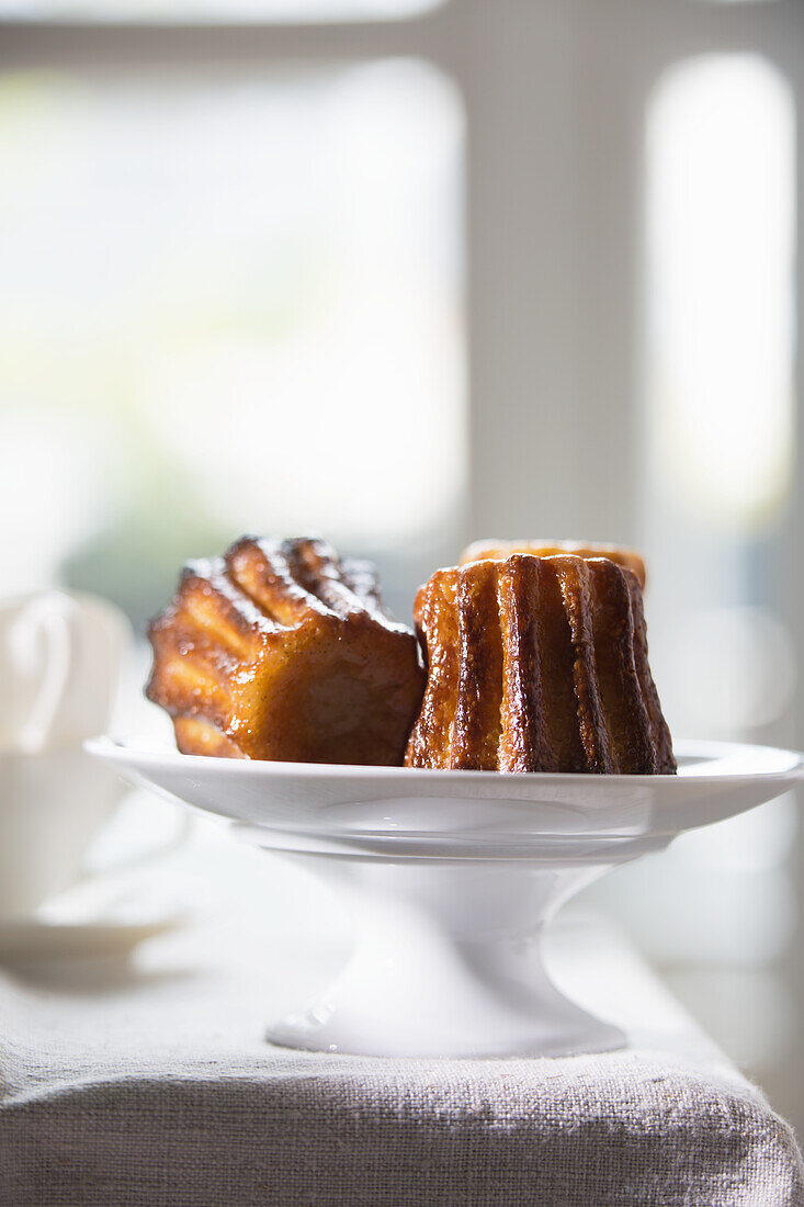 Canelé - French pastry with rum and custard center