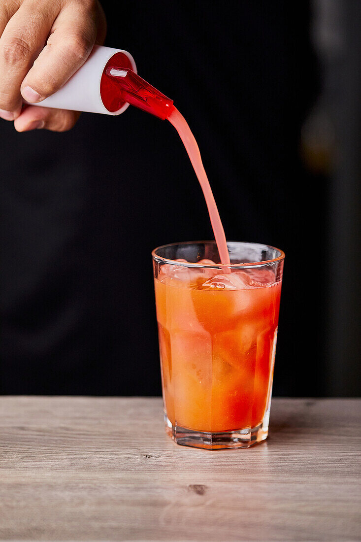 Mixing a watermelon cocktail - Adding watermelon juice