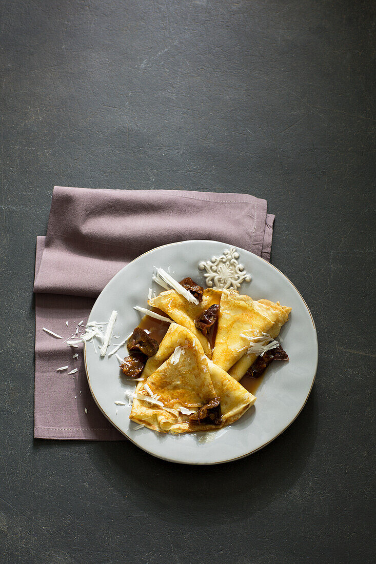Crepes with plums and white chocolate