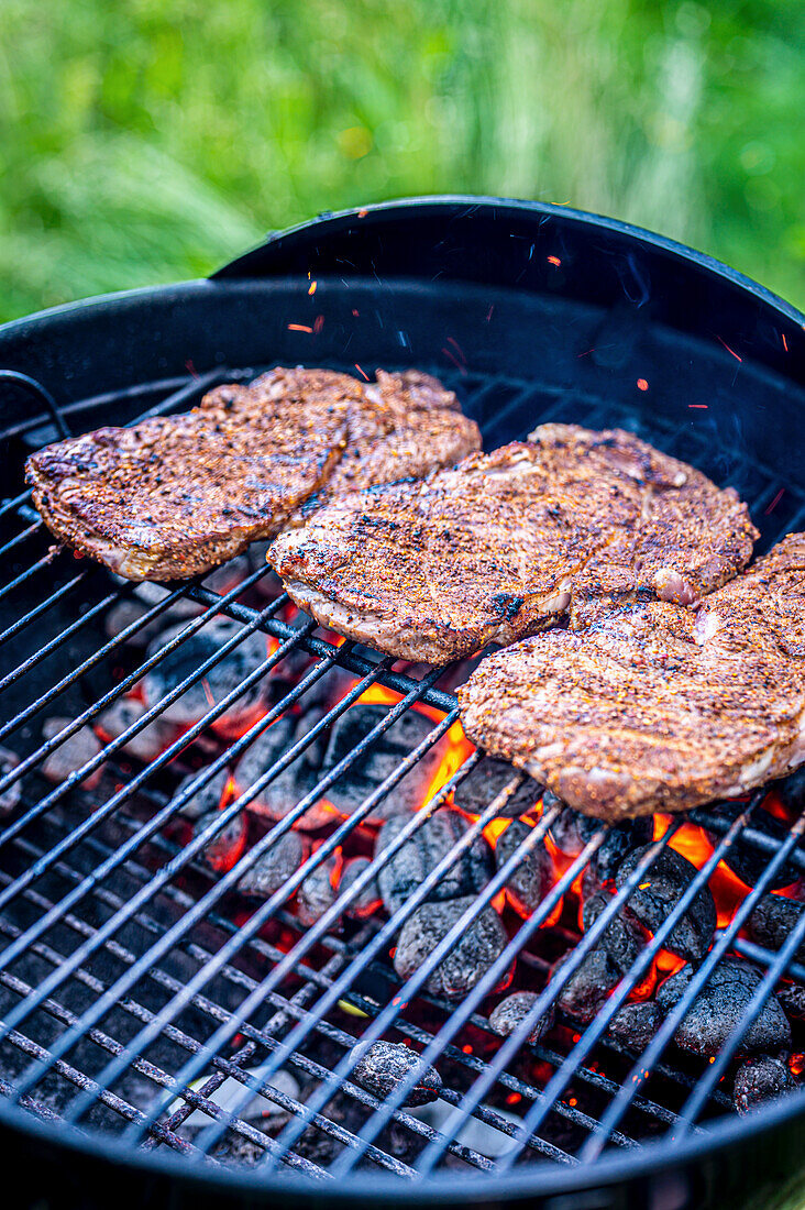 Steaks on a charcoal grill