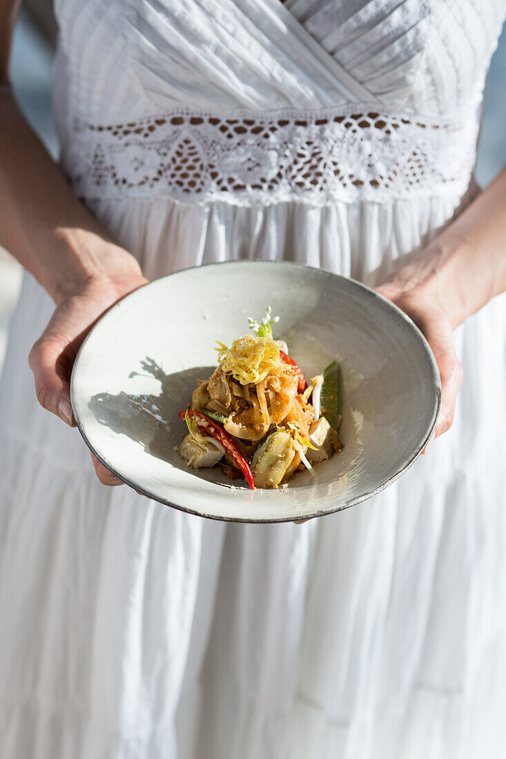 Woman serving Pad Thai