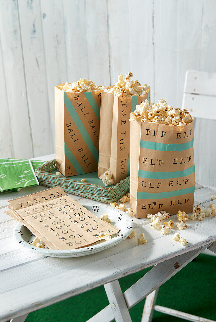 Printed paper bags with popcorn for soccer game night