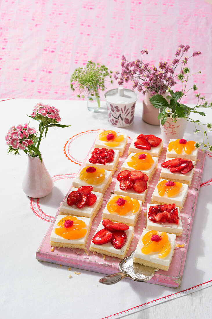 Coconut slices with strawberries and mango