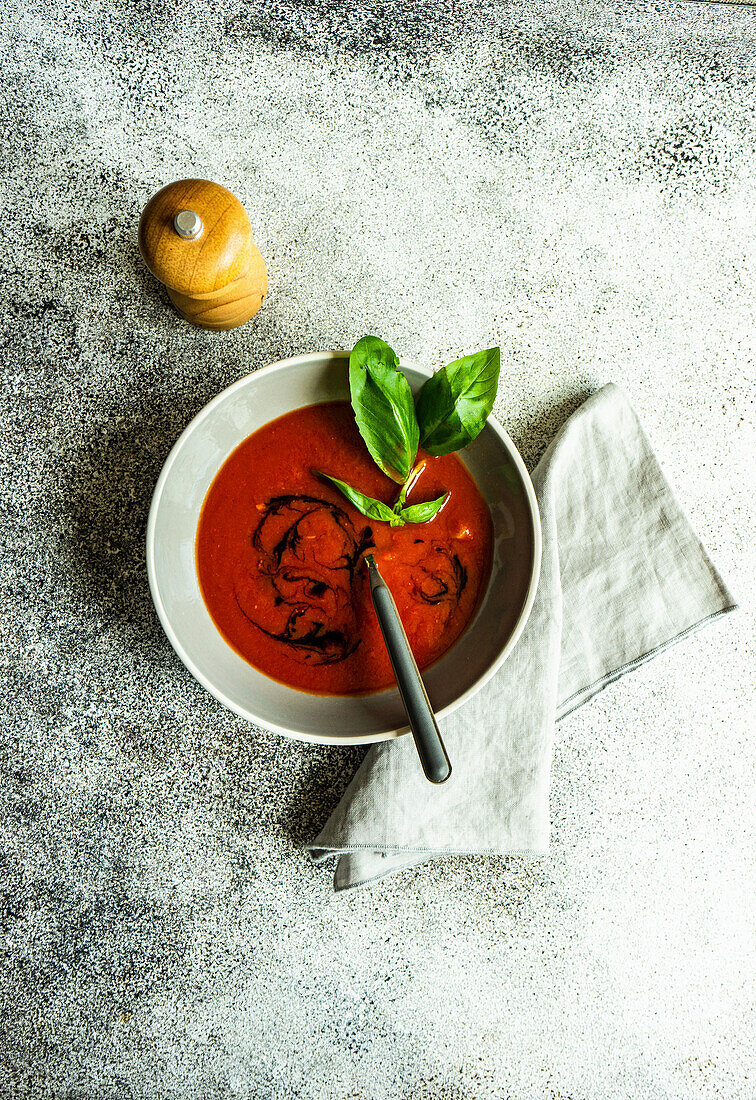 Served spanish gazpacho soup on rustic background