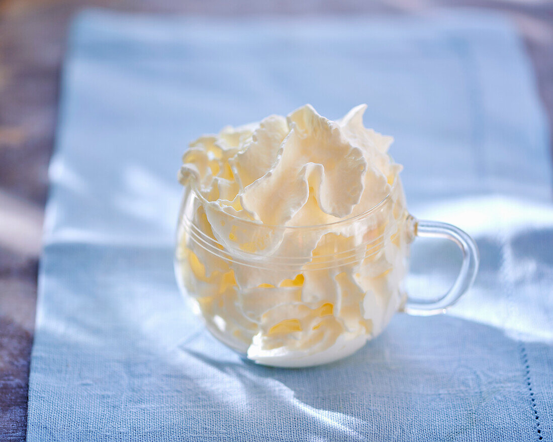 Whipped cream in a glass cup