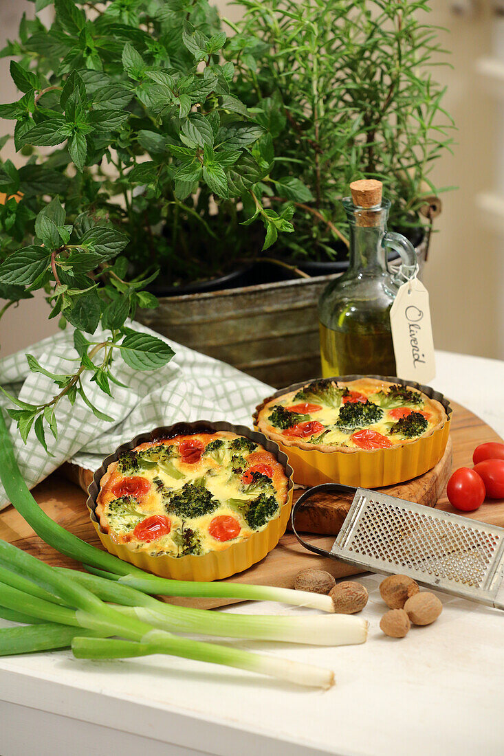 Quiche with wild herbs, vine shoots and broccoli