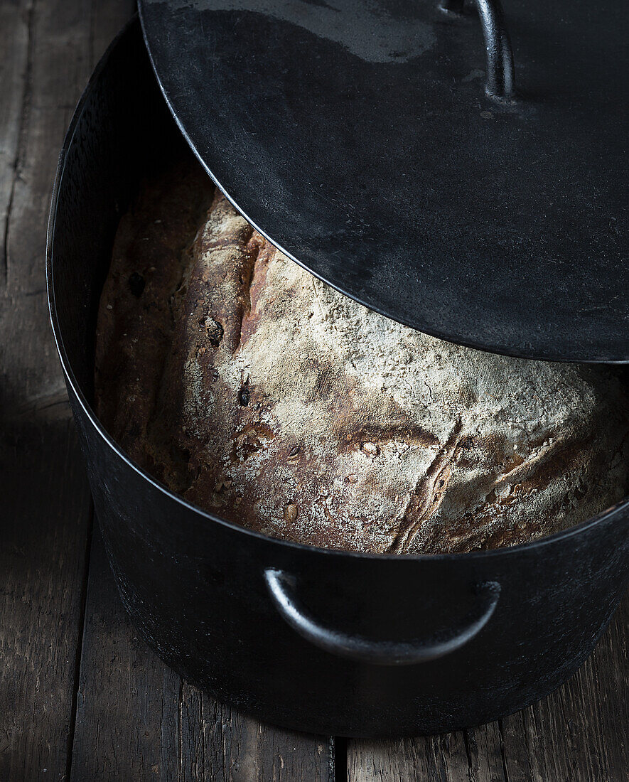 Grain bread with dried fruit baked in a pot