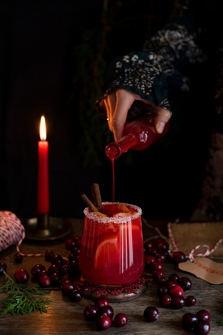 Christmas cranberry moctail with cinnamon and oranges