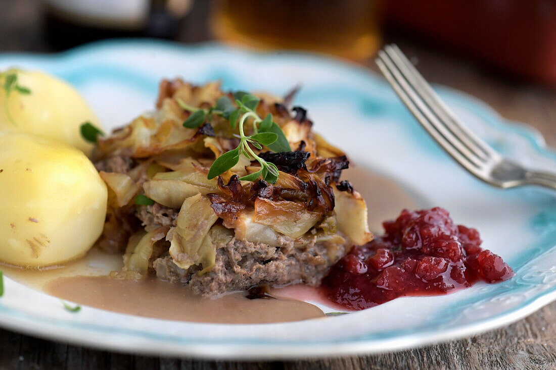 Cabbage pudding with potatoes and cranberries