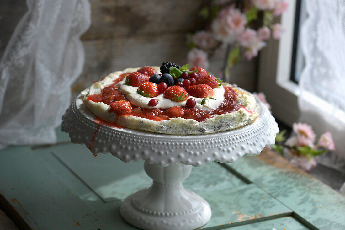 Summer berry pizza on a cake stand