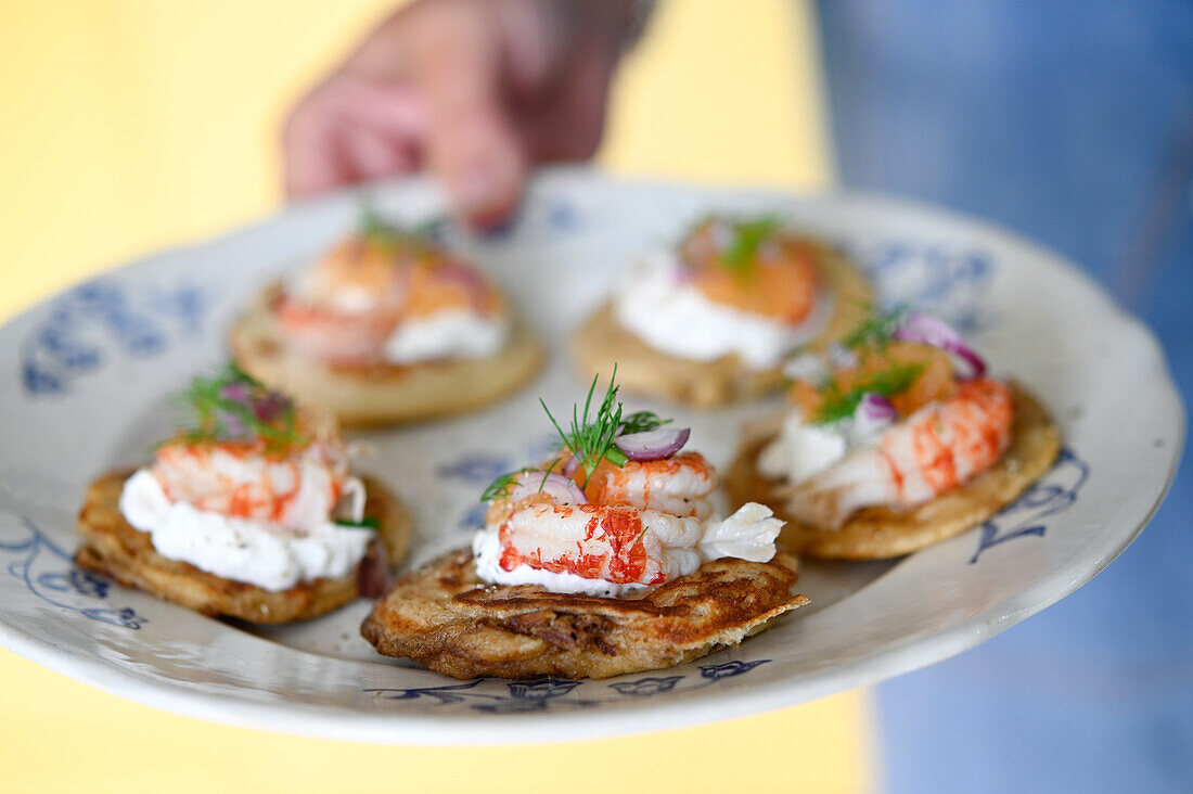 Blinis with Västerbotten cheese, prawns and caviar