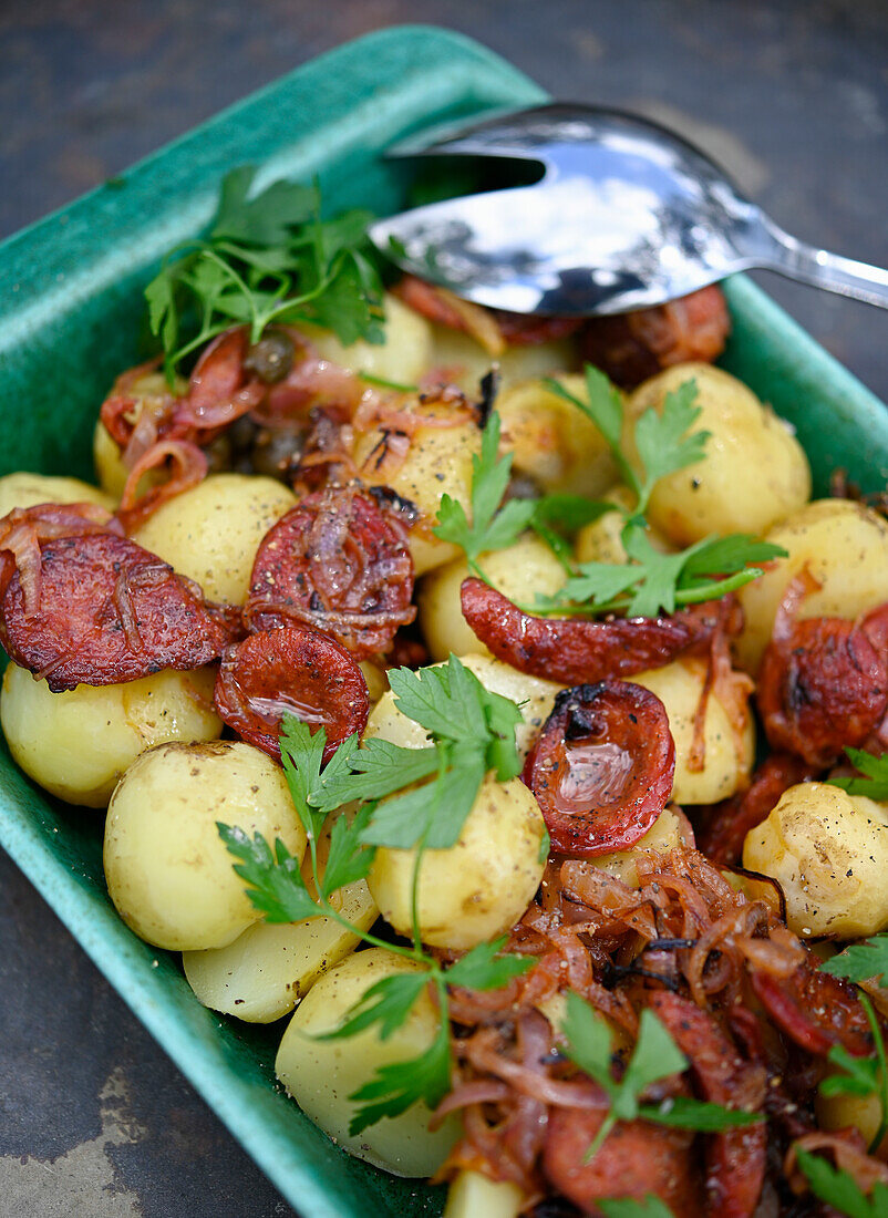 Early potatoes with chorizo and caramelized onions
