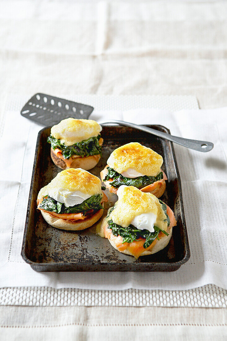 English muffins with salmon, spinach, and poached egg from the oven