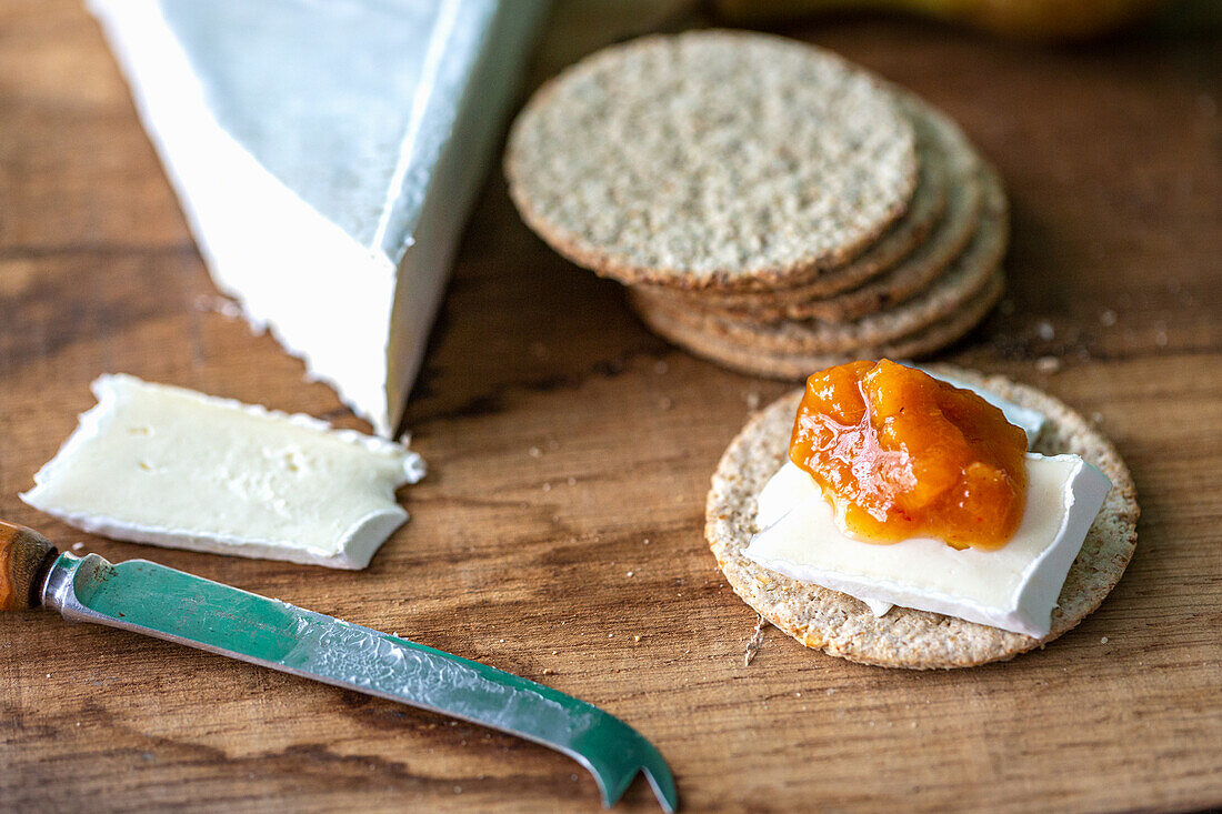 Brie cheese with oat crackers and apricot chutney