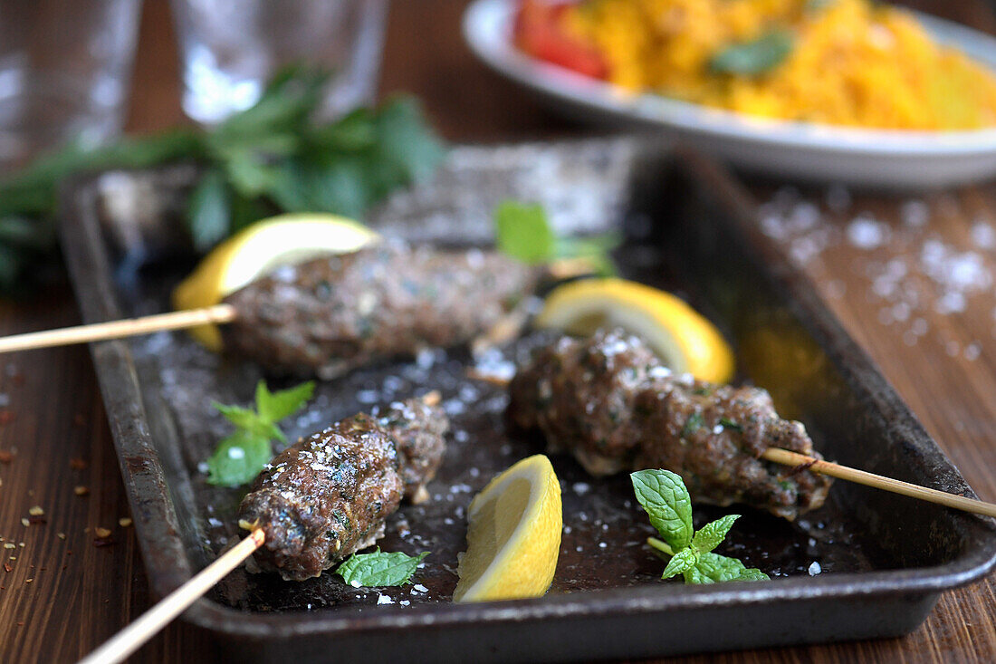 Spicy lamb skewers with saffron bulgur wheat