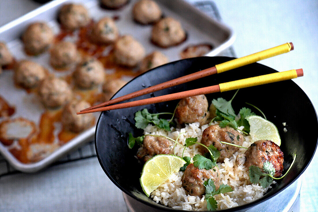 Asian meatballs with lime and coriander on rice