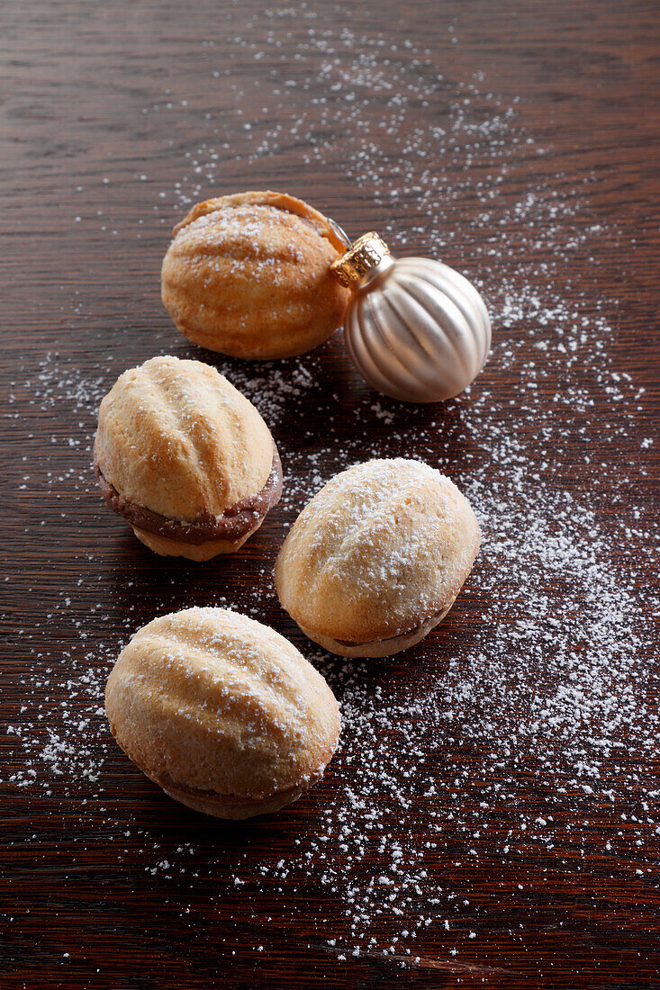 Christmas cookies in the shape of walnuts with chocolate filling