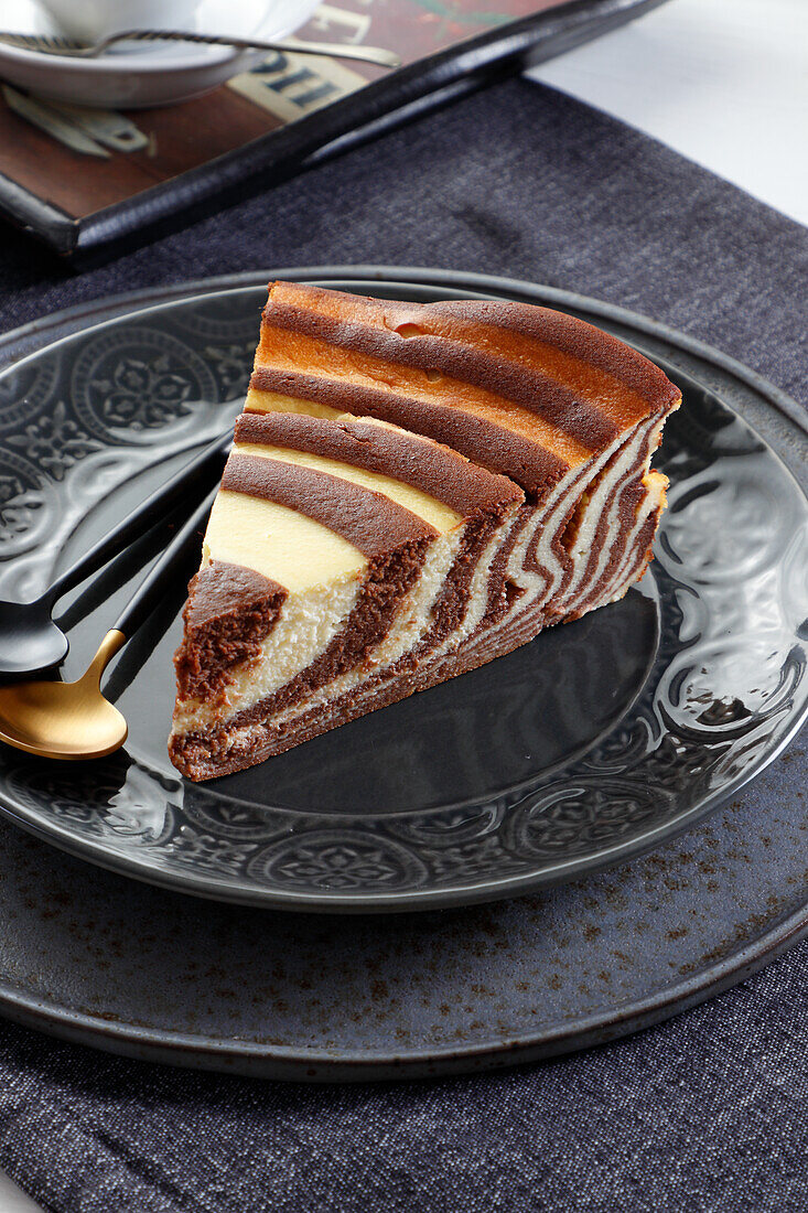 A slice of chocolate zebra cheesecake