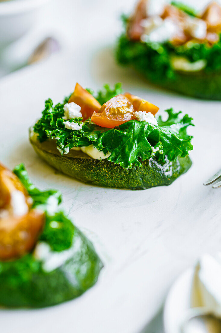 Fried zucchini with kale, soft cheese and cherry tomatoes