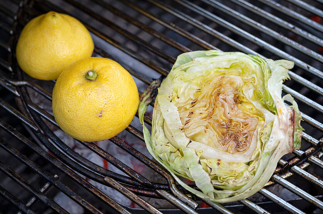 Grilled iceberg lettuce and lemon halves