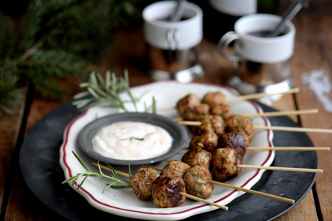 Rosemary meatballs on skewers with dip