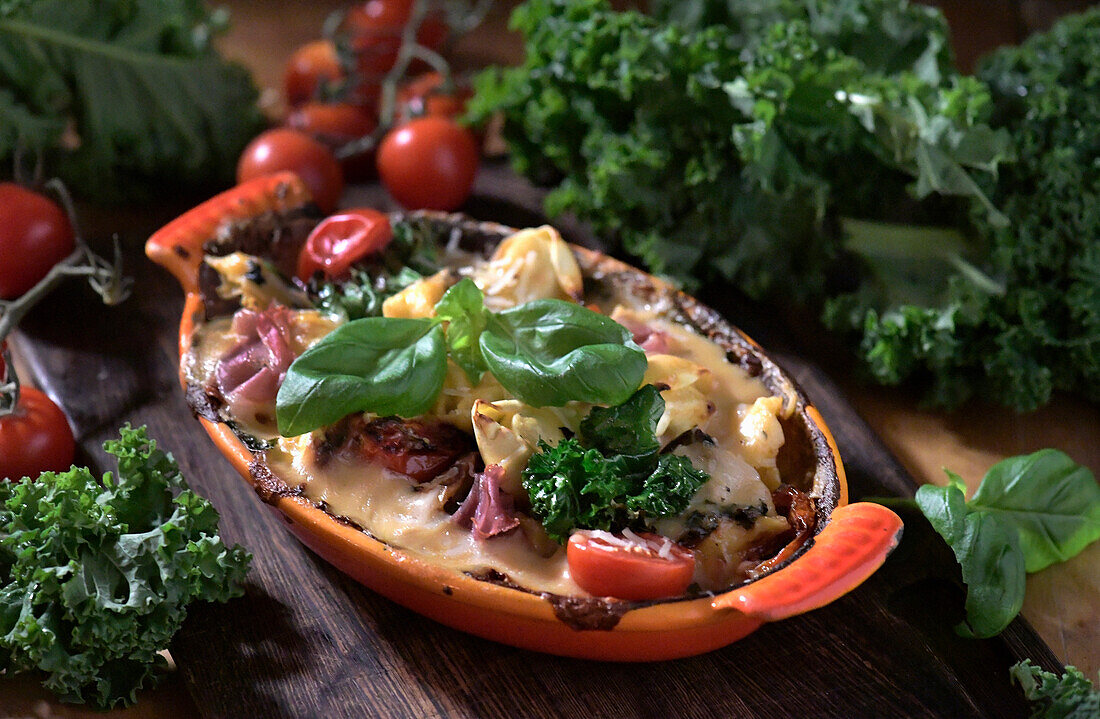 Tortellini gratin with kale, ham, and cheese sauce