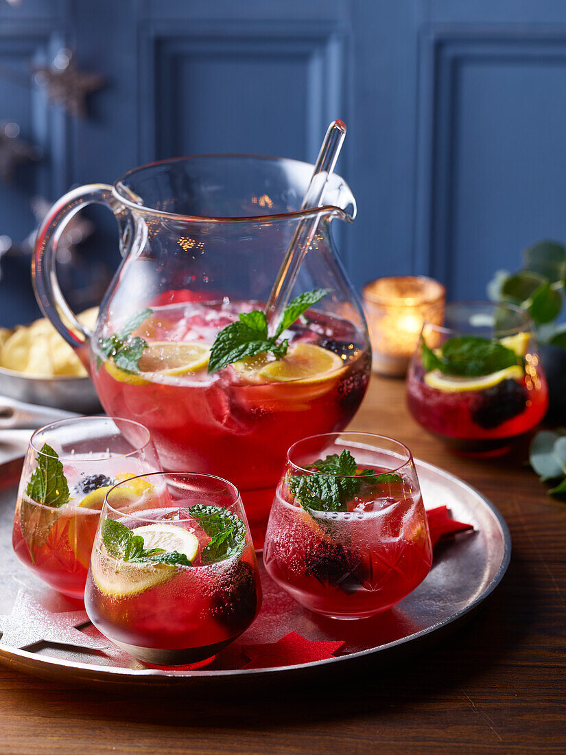 Christmas punch with cranberries and blackberries