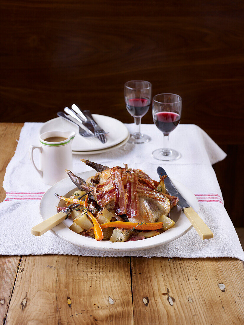 Fried guinea fowl with bacon and vegetables (One Pot)