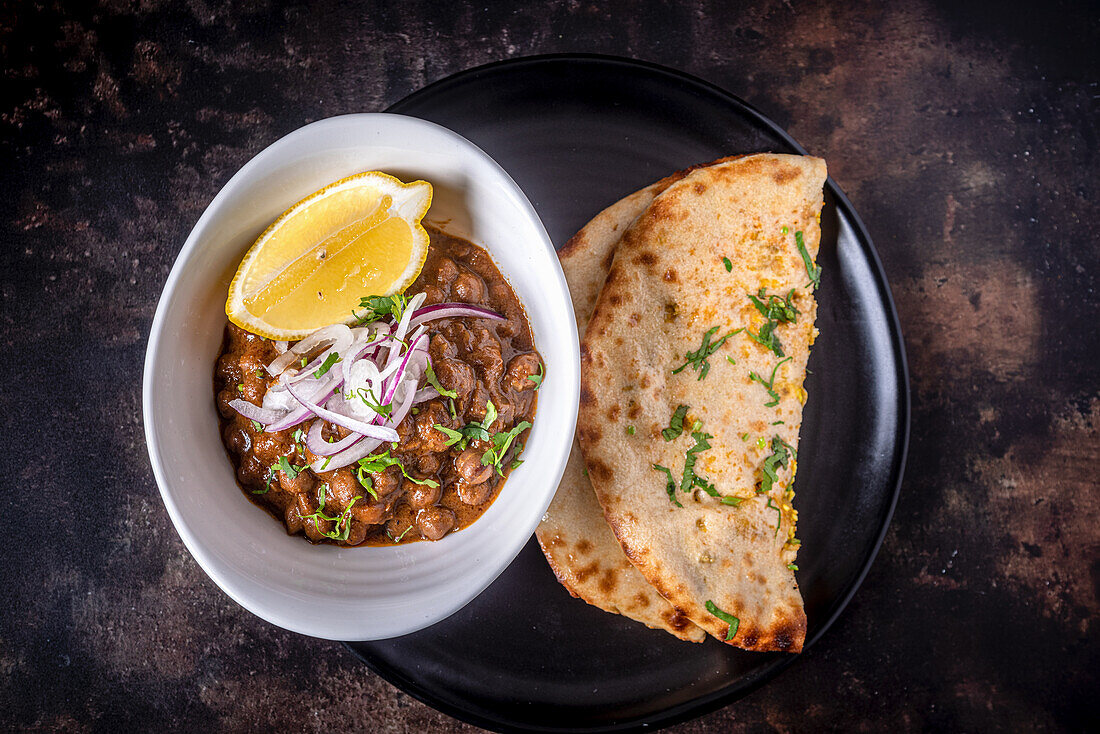 Chole and Paneer Kulcha (baked paneer bread with spiced chickpeas, India)