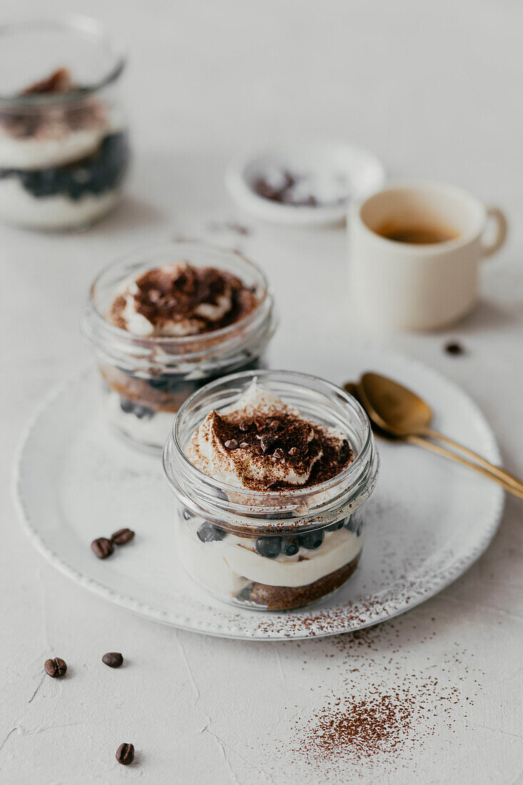 Tiramisu in a glass with blueberries