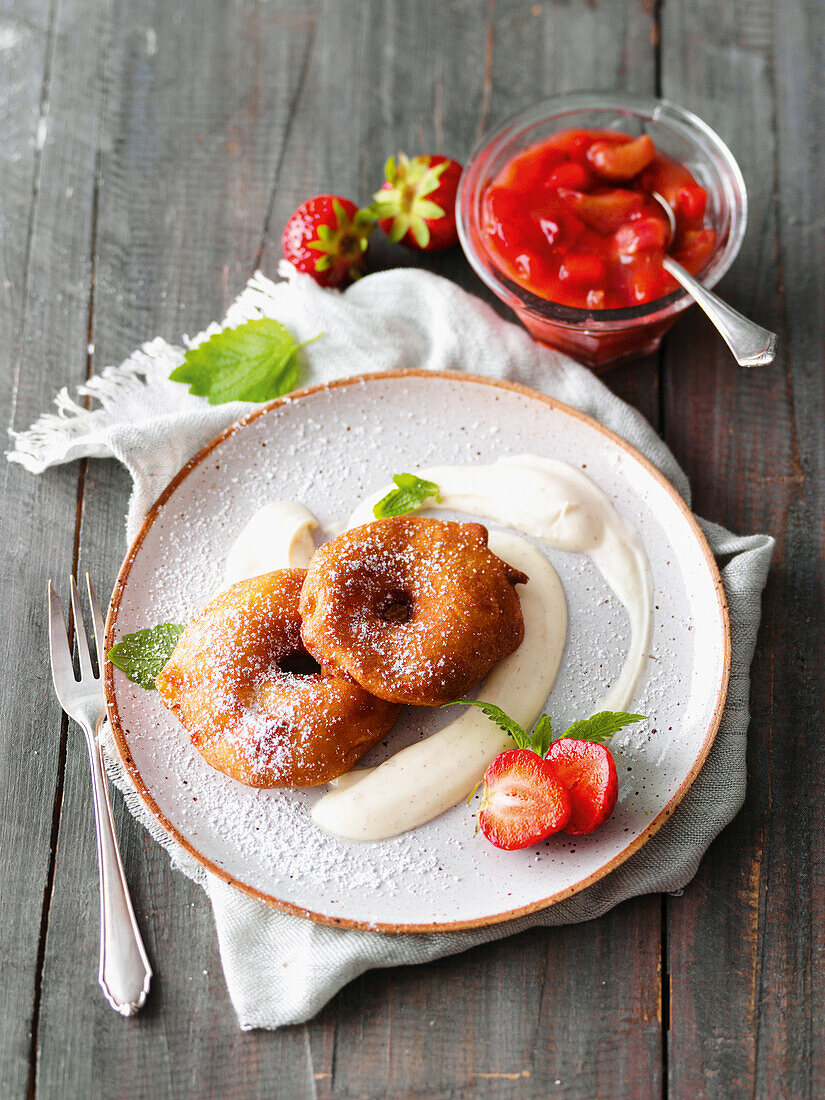 Apple fritters with vanilla yoghurt and strawberry-rhubarb compote