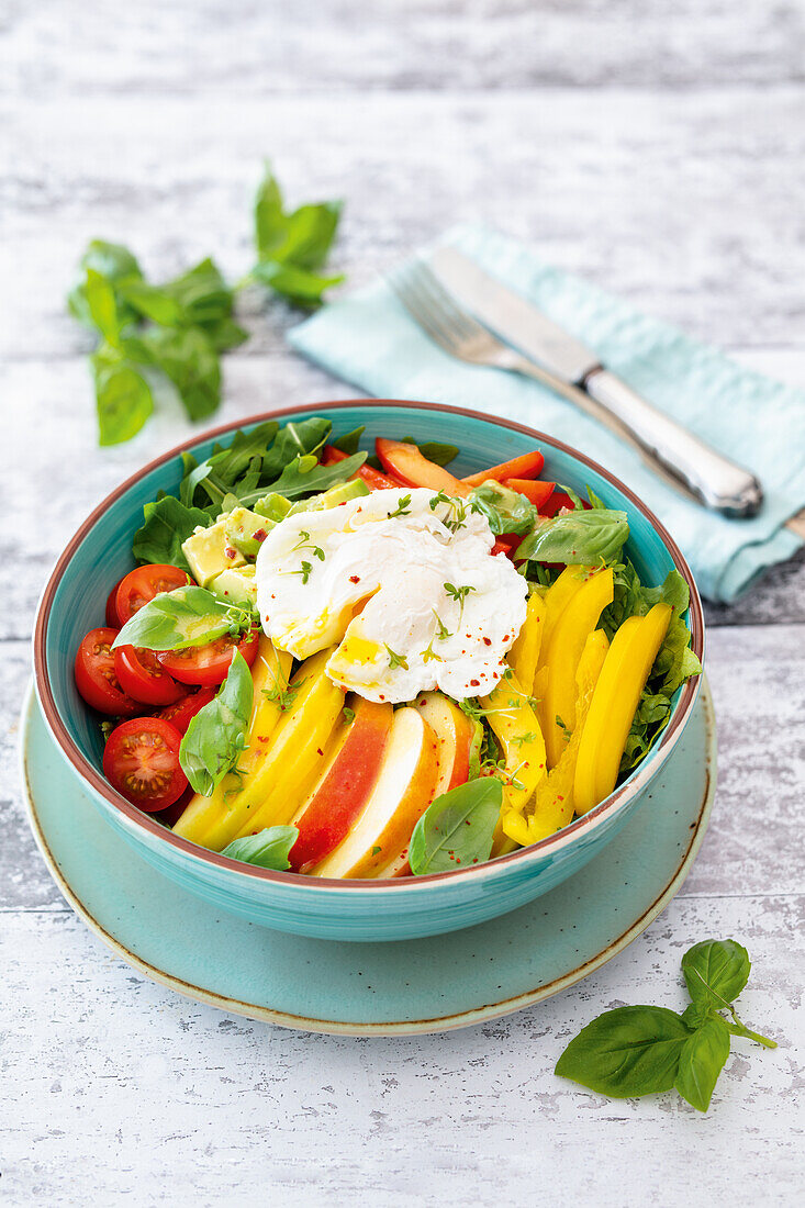 Salad bowl with a poached egg