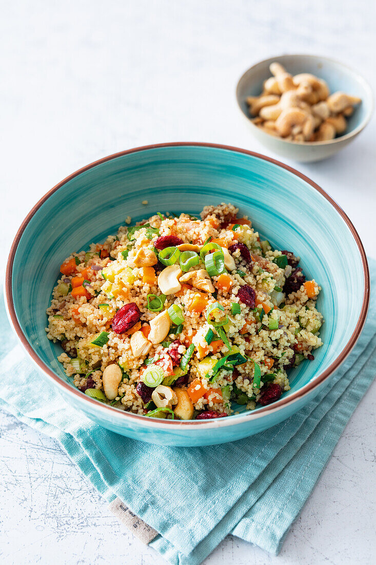 Couscous salad with sultanas, carrots, courgettes and cashew nuts