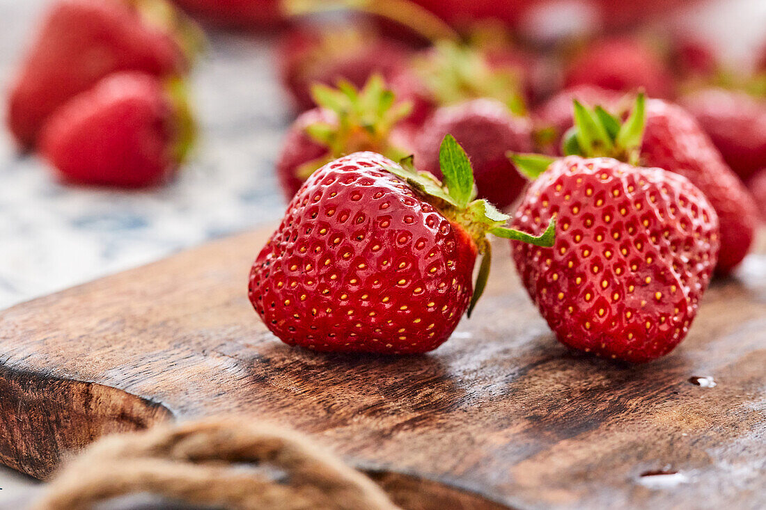 Fresh strawberries on wooden board