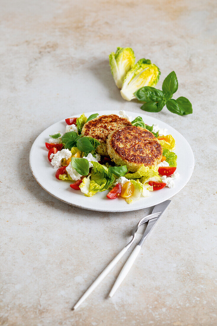 Cauliflower fritters with tomato salad