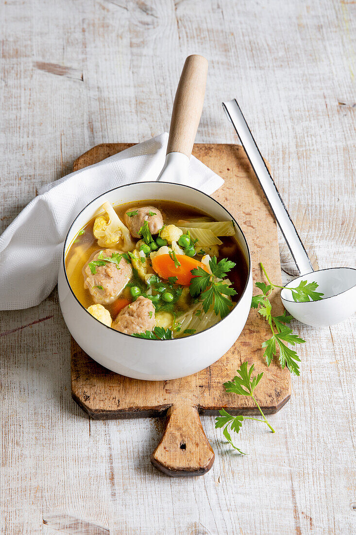 Colourful vegetable soup with barley dumplings