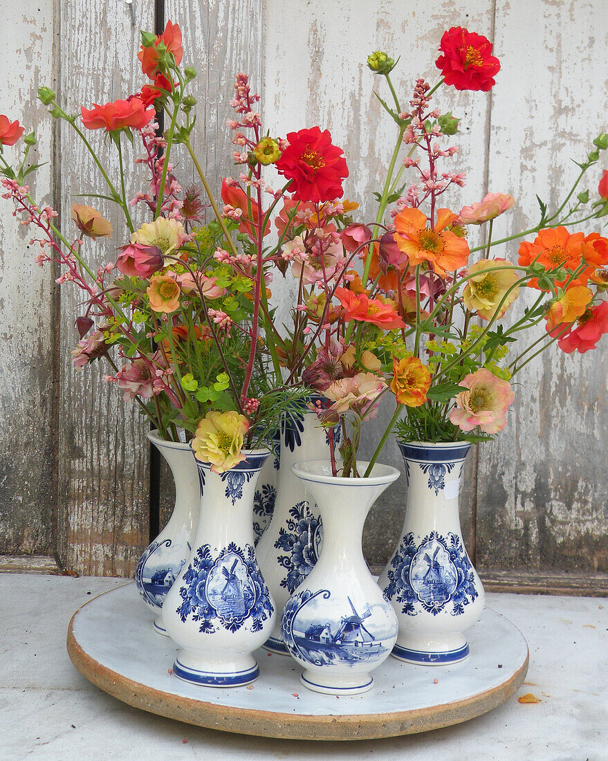 Bouquet of Avens (Geum) in ceramic vases