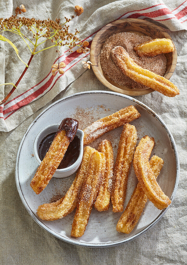 Churros with cinnamon and hot chocolate