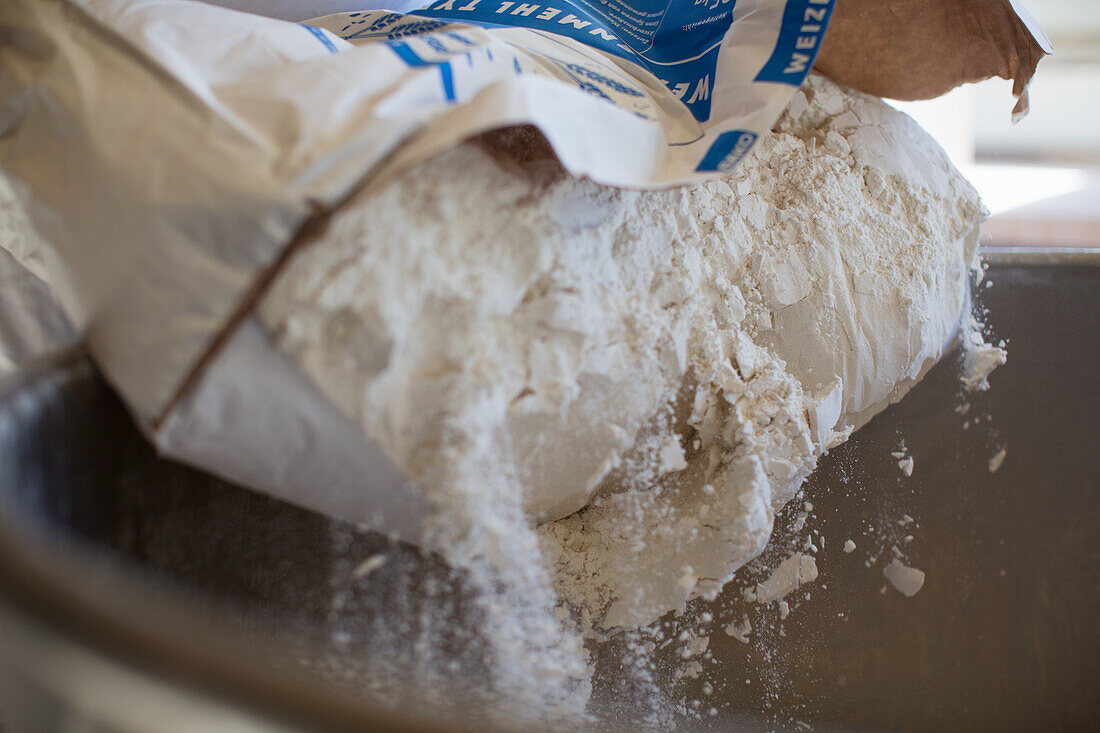 Flour being poured out of a sack