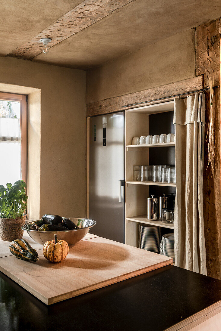 Dish rack with curtain in kitchen with exposed post and beam