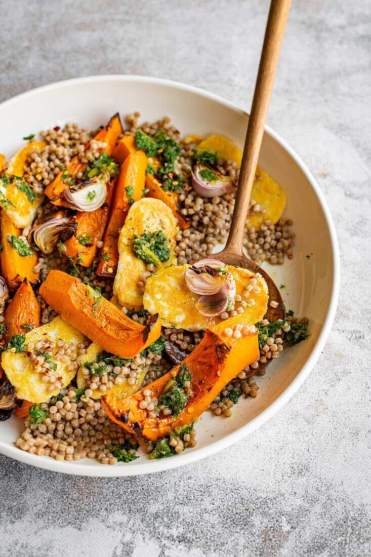 Pearl couscous salad with butternut squash, roasted red onions and herb dressing